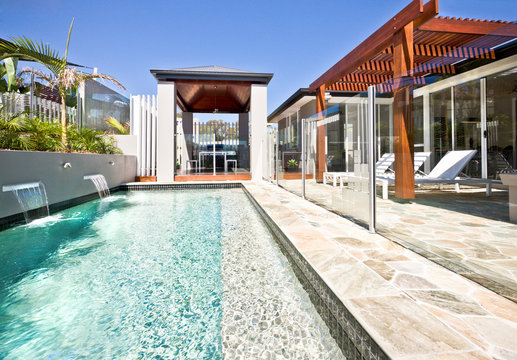 A large swimming backyard pool in modern house