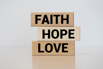 biblical, spiritual or metaphysical reminder - faith, hope and love in old wooden letterpress type...