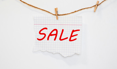Torn paper with a word Sale