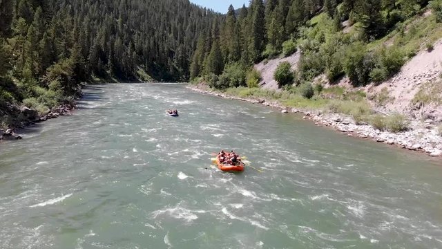 Video of a group of tourists having fun doing rafting on a river in Wyoming, USA