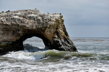 Waves crashing on cliffs