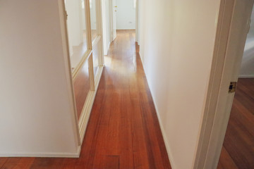 empty hallway with wooden floor