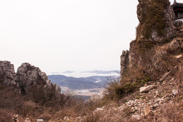 Scenic mountainscape with rock cliffs during mountain hiking.