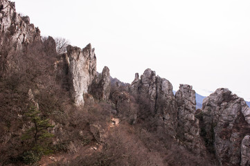 Scenic mountainscape with rock cliffs during mountain hiking.