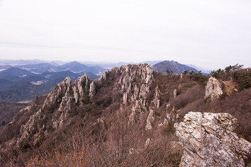 Scenic mountainscape with rock cliffs during mountain hiking.