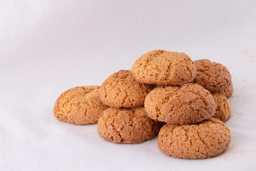 Pyramid of delicious almond cookies on white