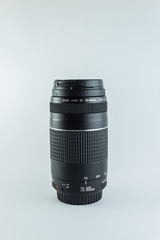Stock Photo of Black telephoto lens with white background and infinite effect