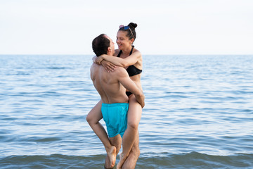 Lifting Woman At Beach At Sea