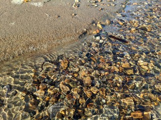 clear water of a stream with a stone bottom