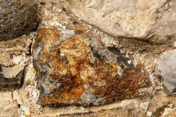 Close up of textured surface of ancient ruins. Old English flint stone weathered by the centuries