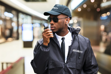 Security Guard Using Walkie Talkie