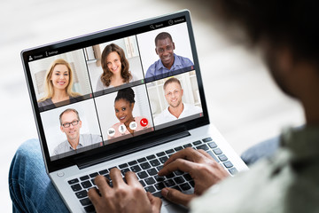 Young Man Using Laptop At Home