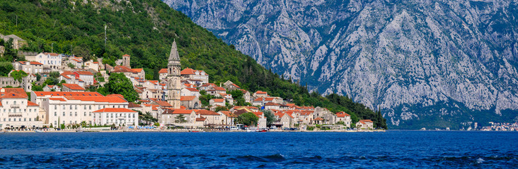 Fototapeta na wymiar Panorama of Perast in Kotor Bay day with mountains in the background, Montenegro