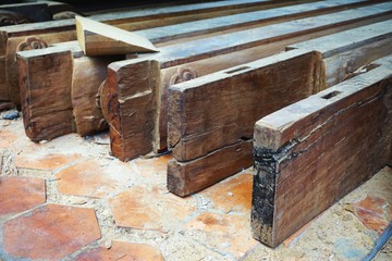 Vintage carved timbers at a temple restoration site in Vietnam