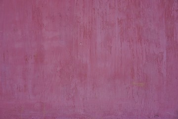 Streaky faded red plaster wall abstract horizontal background texture