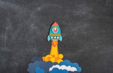 Rocket takes off. Back to school. Copy space. Business concept