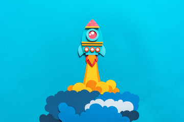 Rocket takes off paper craft. Back to school. Copy space. Business concept