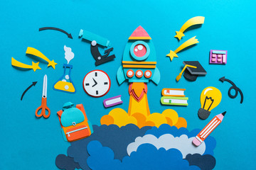 Rocket takes off paper craft. Back to school. Copy space. Education concept