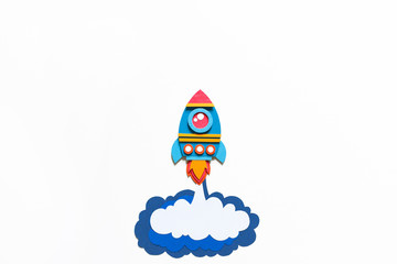 Rocket takes off paper craft. Back to school. Copy space. Business concept