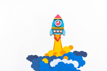 Rocket takes off paper craft. Back to school. Copy space. Business concept