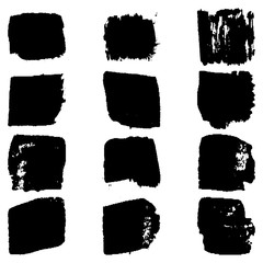 A set of paint strokes with a dry brush. Grunge spots black on white background. Black artistic paint, hand drawn. Dry Brush Stroke elements collection