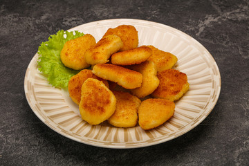 Fried chicken nuggets served salad leaves