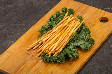 Chechel cheese sticks over board