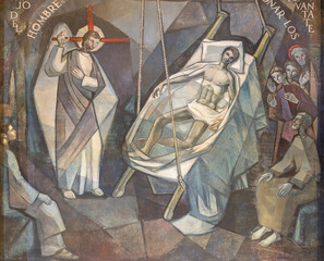 BARCELONA, SPAIN - MARCH 5, 2020: The modern fresco Jesus Heals lame man in church Santuario Maria Auxiliadora i Sant Josep by Fidel Trias Pages and Raimon Roca (1966).
