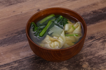 Asian traditional Wonton soup with herbs