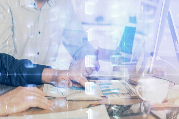 Double exposure of technology hologram with man working on computer background. Concept of big data.