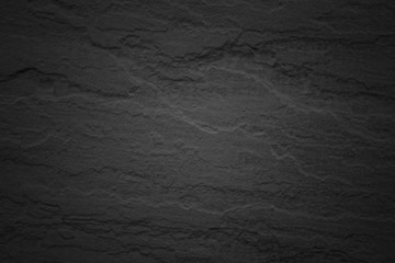 Texture and seamless background of black granite stone