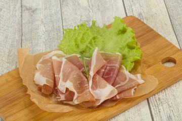 Italian prosciutto pork meat over board
