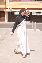 Fototapeta premium Fashion portrait of young beautiful asian muslim woman with wearing hijab