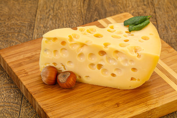 Maasdam cheese - yellow triangle with holes