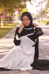 Obraz premium Fashion portrait of young beautiful asian muslim woman with wearing hijab