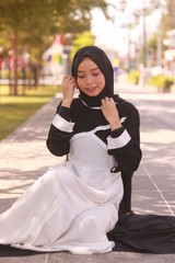 Fototapeta premium Fashion portrait of young beautiful asian muslim woman with wearing hijab