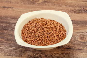 Raw buсkwheat cereal in the bowl