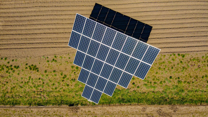 Farm solar sub station. Rotating solar panels at the rural area. Small electric station for covering personal needs.