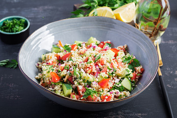 Tabbouleh salad. Traditional middle eastern or arab dish. Levantine vegetarian salad with parsley, mint, bulgur, tomato.