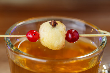 Decor on a glass apple on a skewer