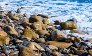 closeup stony sea beach, summer vacation scene