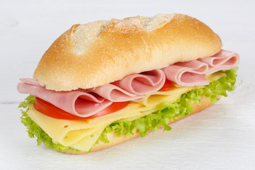 Sandwich with ham and cheese fresh on wooden board