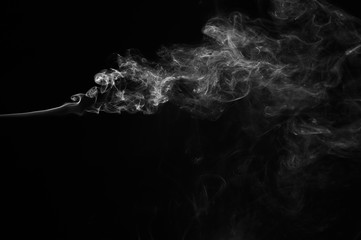 Abstract smoke moves on a black background. Design element. Abstract texture.