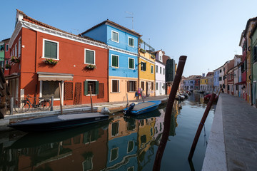 Fototapeta na wymiar Burano Venice. Situated on the Venetian lagoon 7 km from Venice, the island is famous for its colorful houses and numerous canals