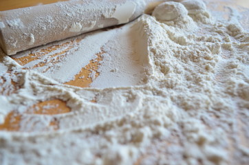 making homemade dumplings with your hands. The table is in flour.