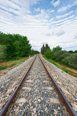 Fototapeta premium Rusty steel and wood train tracks in the Extremadura countryside