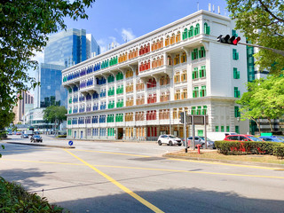 Scenic and colonial architecture buildings in contrast to modern skyscrapers in skyline of Asian...