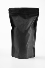 blank black standing pouch container over white background. product mockup