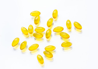 Capsules with vitamins E and A, fish oil on a white background. With an empty space for text. Concept of health care and healthy nutrition.