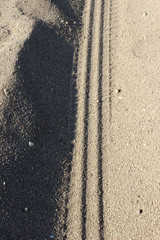 tire tracks on the sand